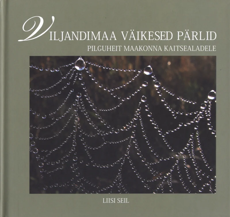 Viljandimaa väikesed pärlid - Liisi Seil (Areal Disain, 2006). Tumedal taustal sädelev kastega kaetud ämblikuvõrk, mille tilgad meenutavad pärleid. Fotograafiline, looduslähedane ja elegantne kaanekujundus rohelakashallides toonides.