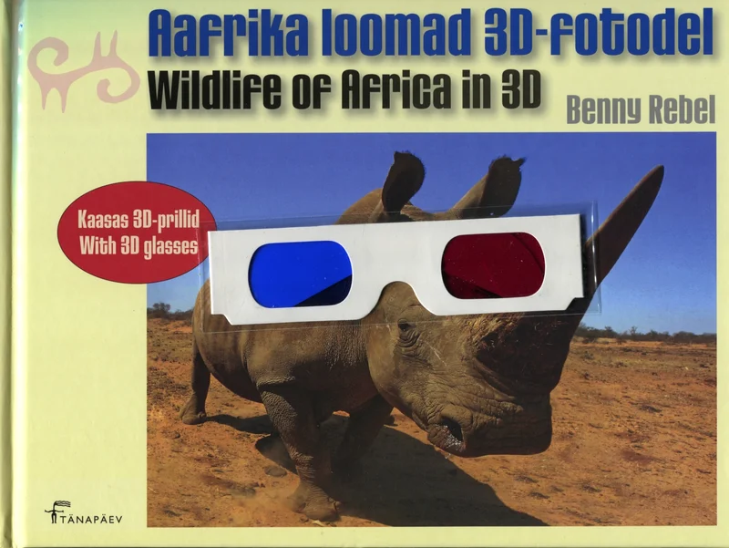 Aafrika loomad 3D-fotodel - Benny Rebel (Tänapäev, 2008). Kaanel on lähivõte ninasarvikust kuivas Aafrika savannipõuas, millele on peale pandud punase-sinise raamiga 3D-prillid. Taust on liivakarva ja hele, rõhutades looma massiivset profiili.